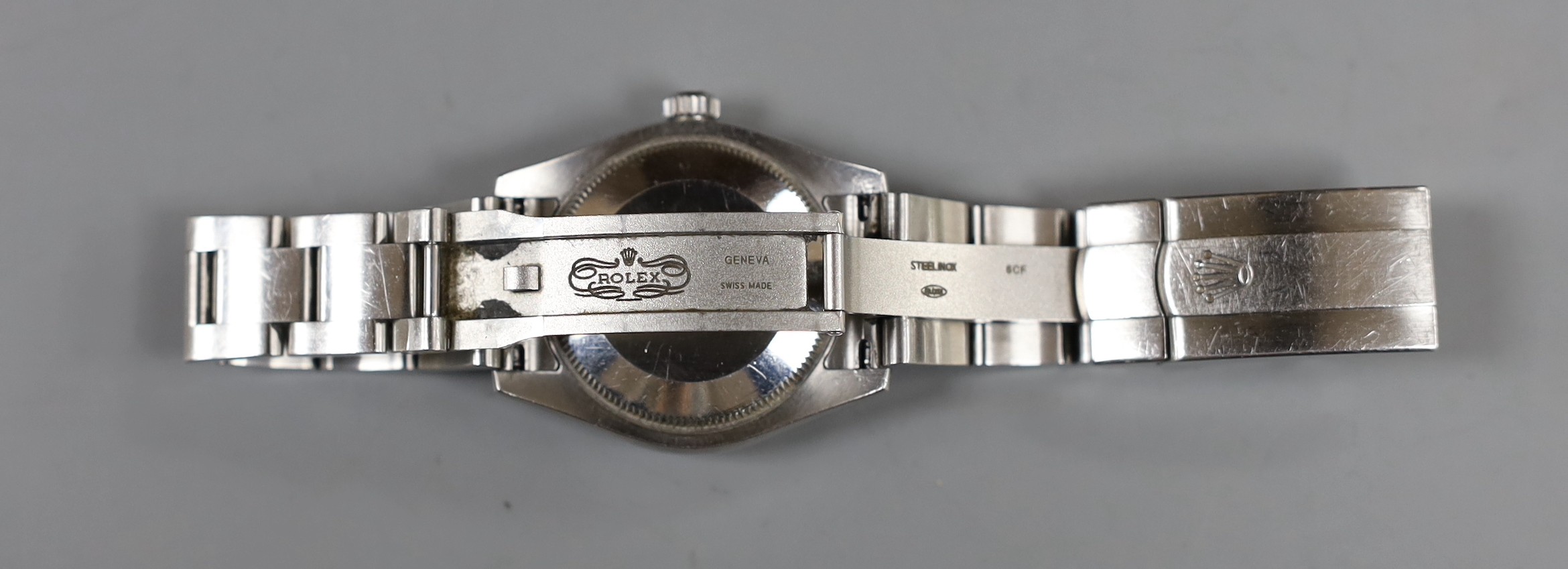 A lady's 2011 stainless steel Rolex Oyster Perpetual wrist watch, on a stainless steel Rolex bracelet, case diameter 31mm, with box and certificate, model no. 177200, serial no. V958067.